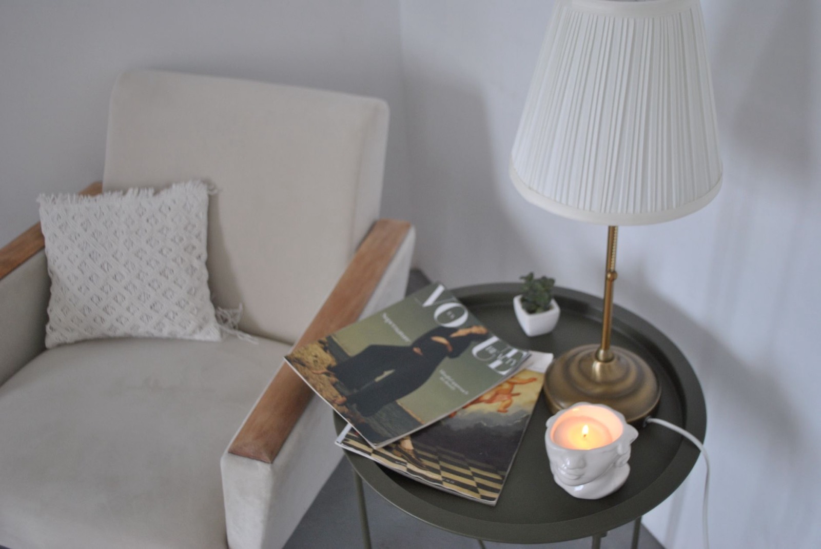 Accent chair positioned beside a sofa in a living room seating group