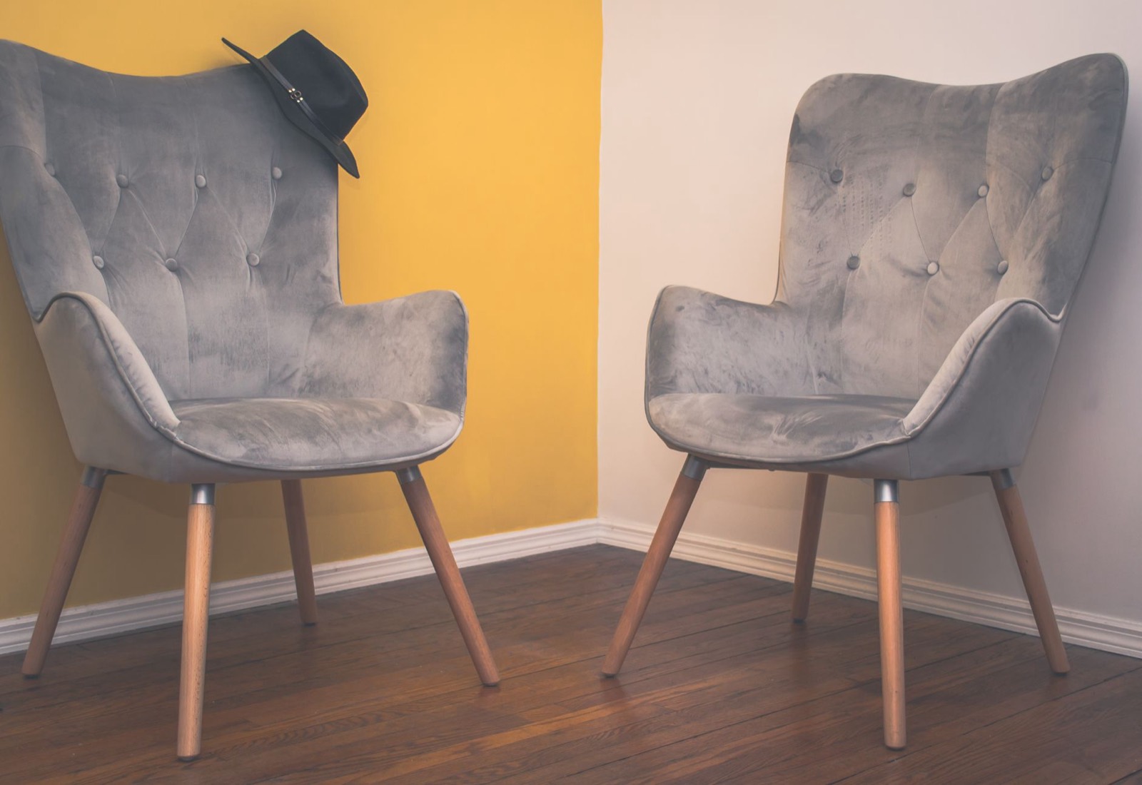 Upholstered accent chair in a bold fabric, where colour is lowest-risk in a room