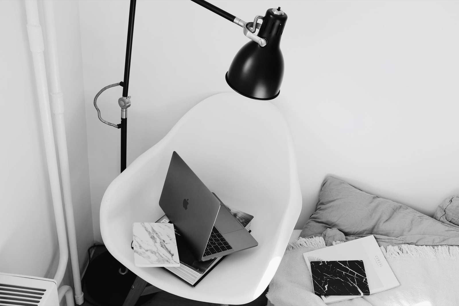 Reading corner combining an accent chair with a lamp and side table