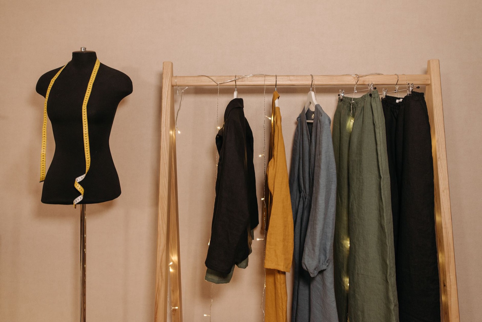 Clothes hanging on a rail, showing the depth a garment on a hanger requires