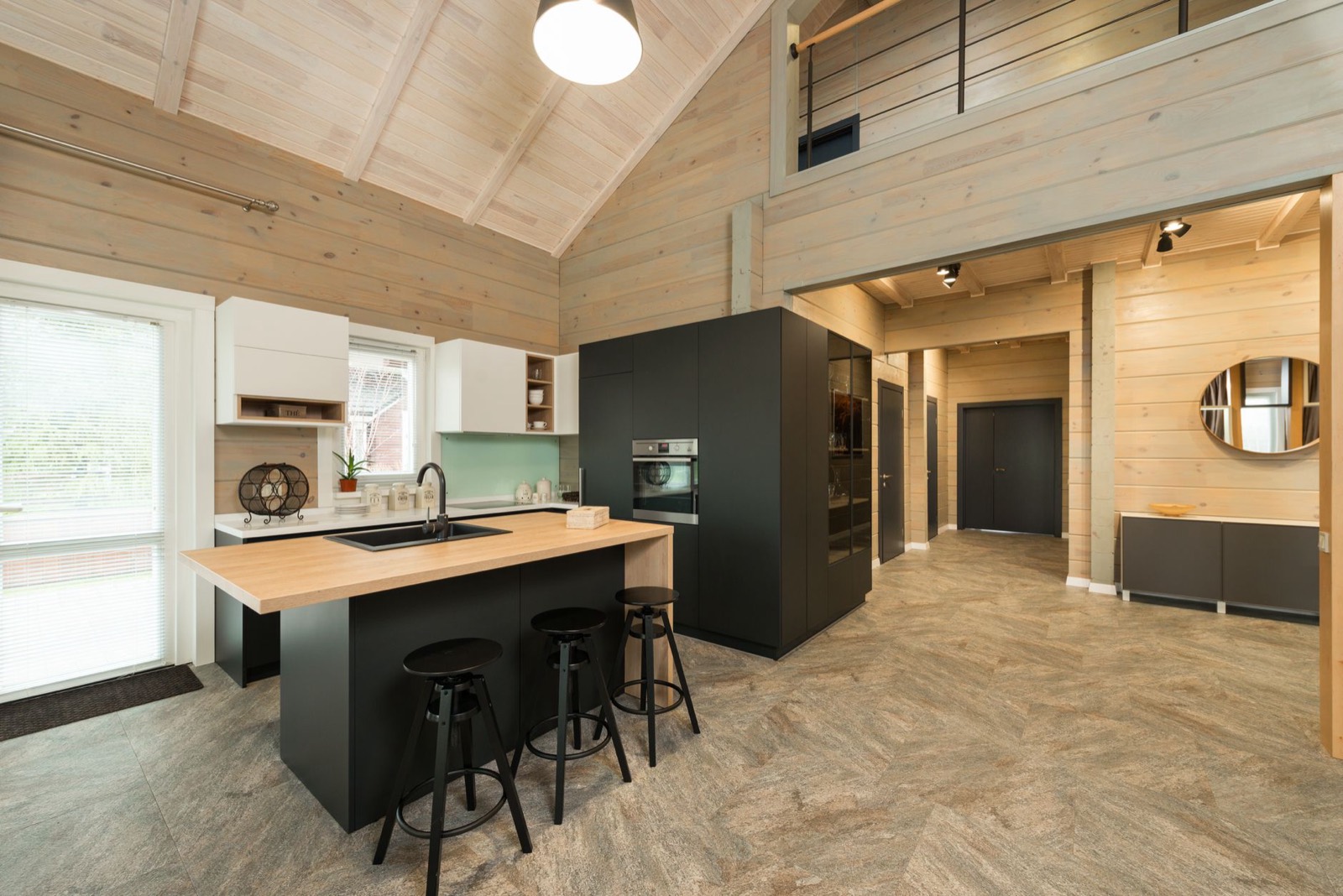Stools lined up at a kitchen island at the correct seat height for the counter