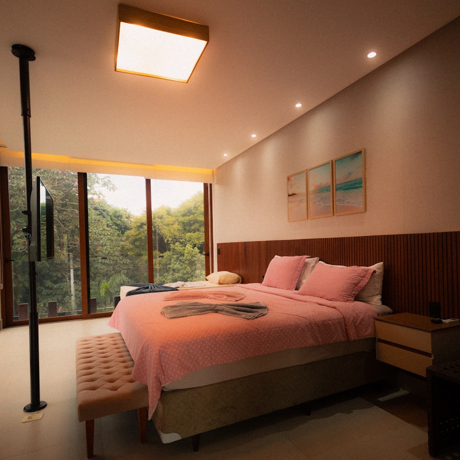 Bedroom with large window and forest view