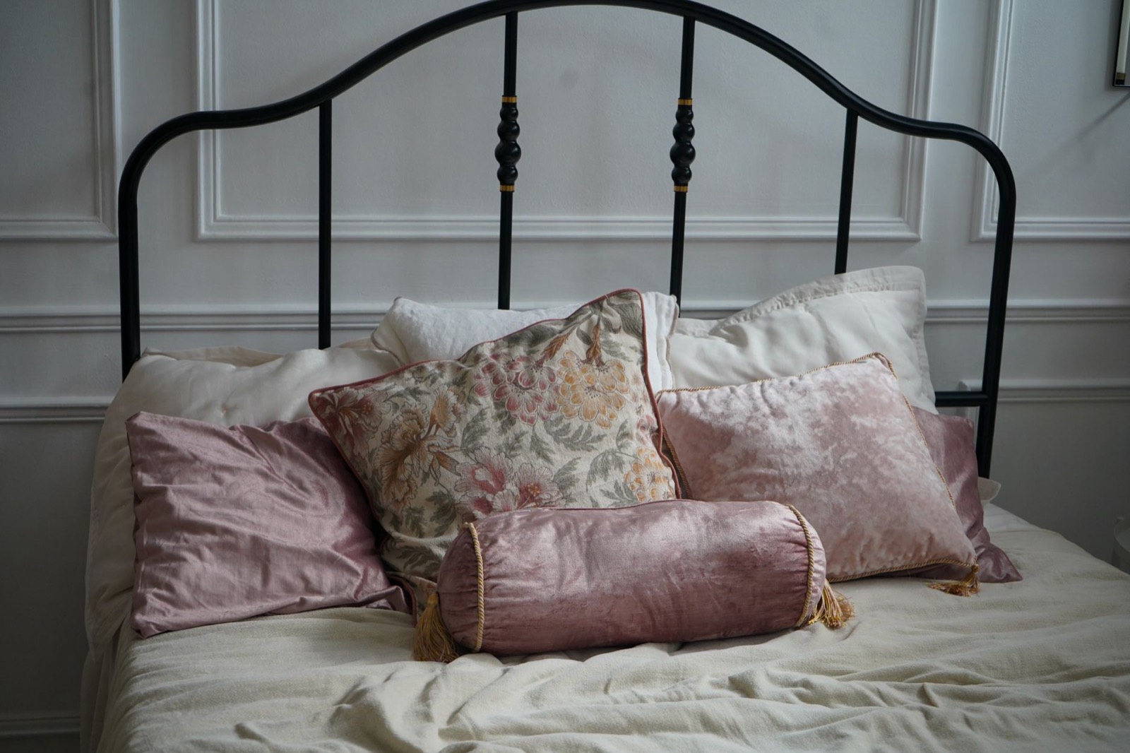 Bed frame with headboard in a styled bedroom setting