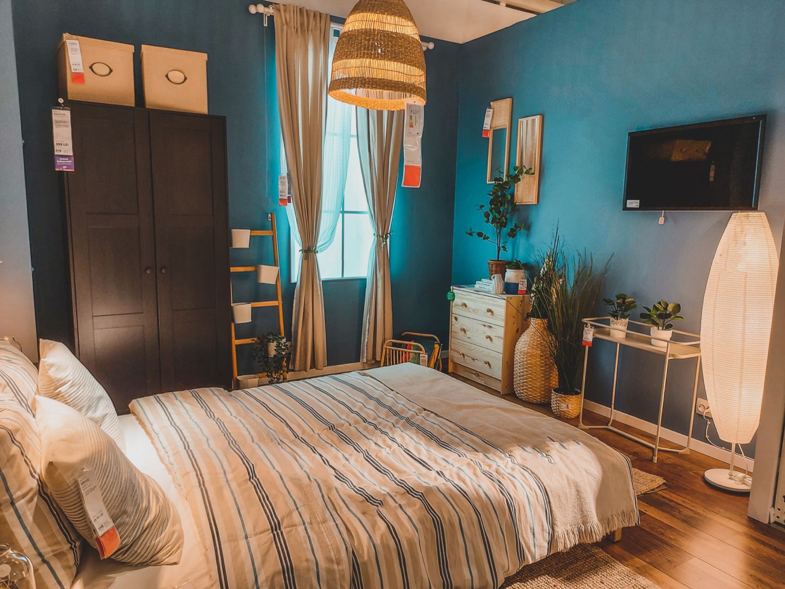 Bed frames displayed in a showroom where height and headboard style can be compared