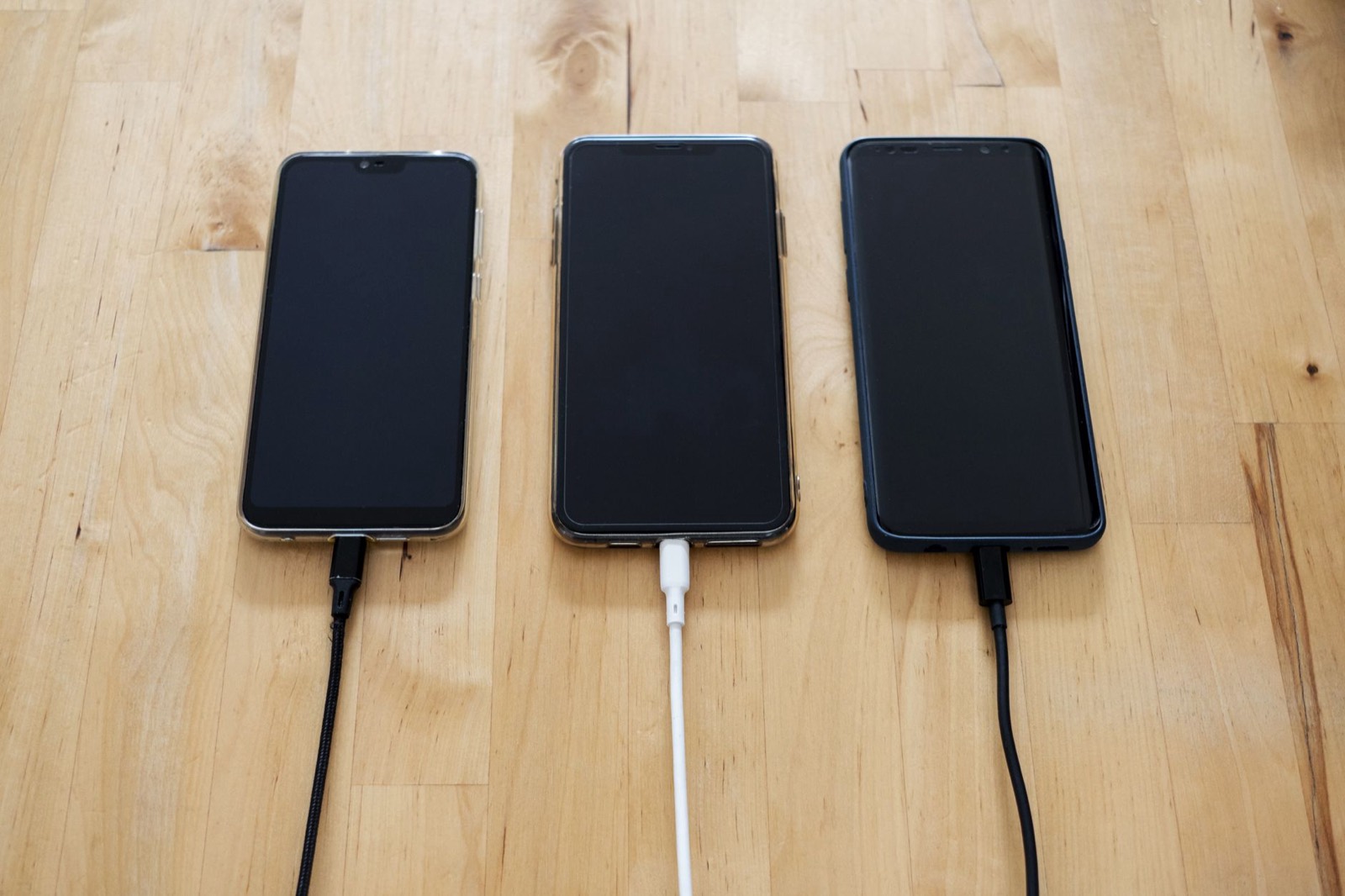 Phone charging on a bedside surface, which should be hard and well ventilated