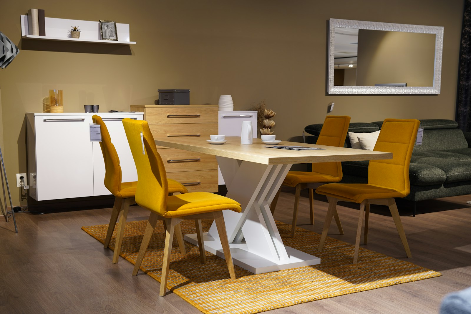 A room with a table, chairs, and a couch