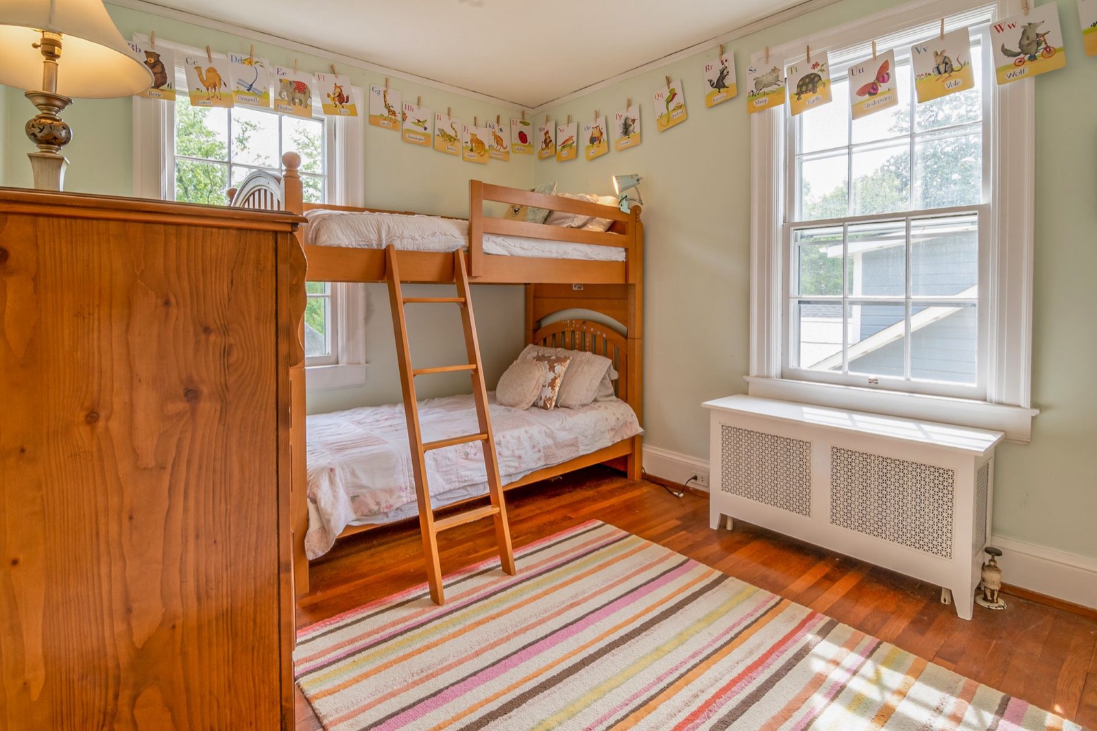 Twin over twin bunk bed in a bright children's bedroom