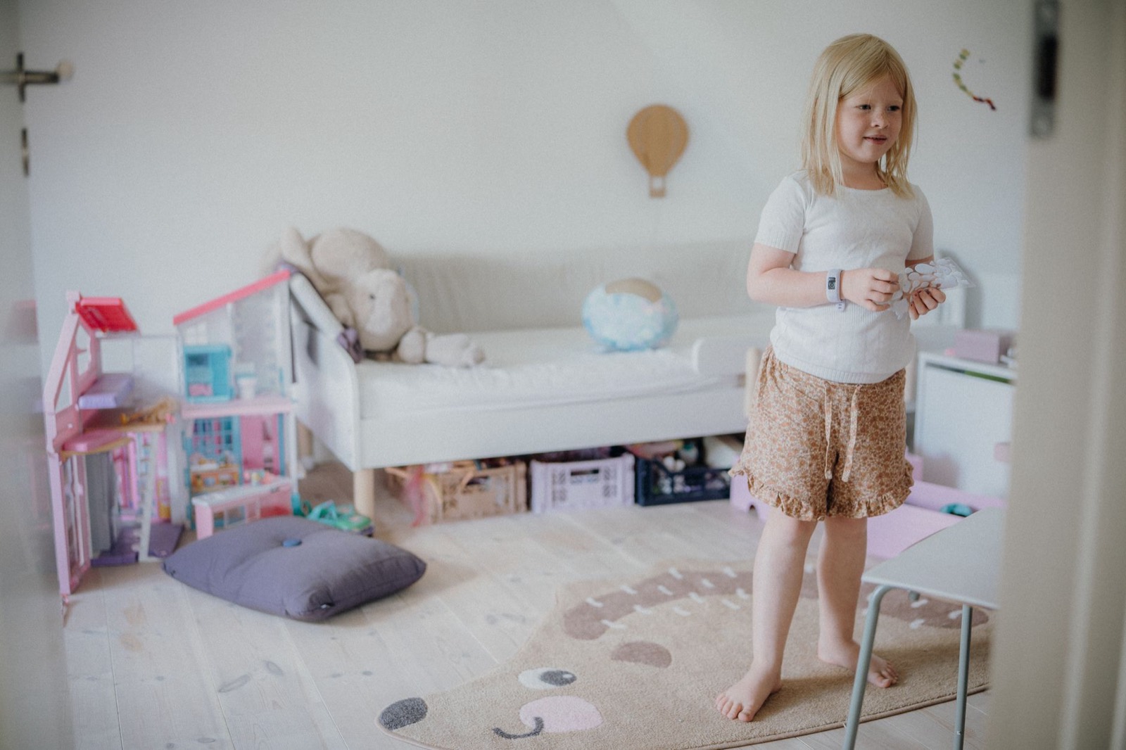 Child-scale bedroom furniture, sized for a young child rather than a teenager