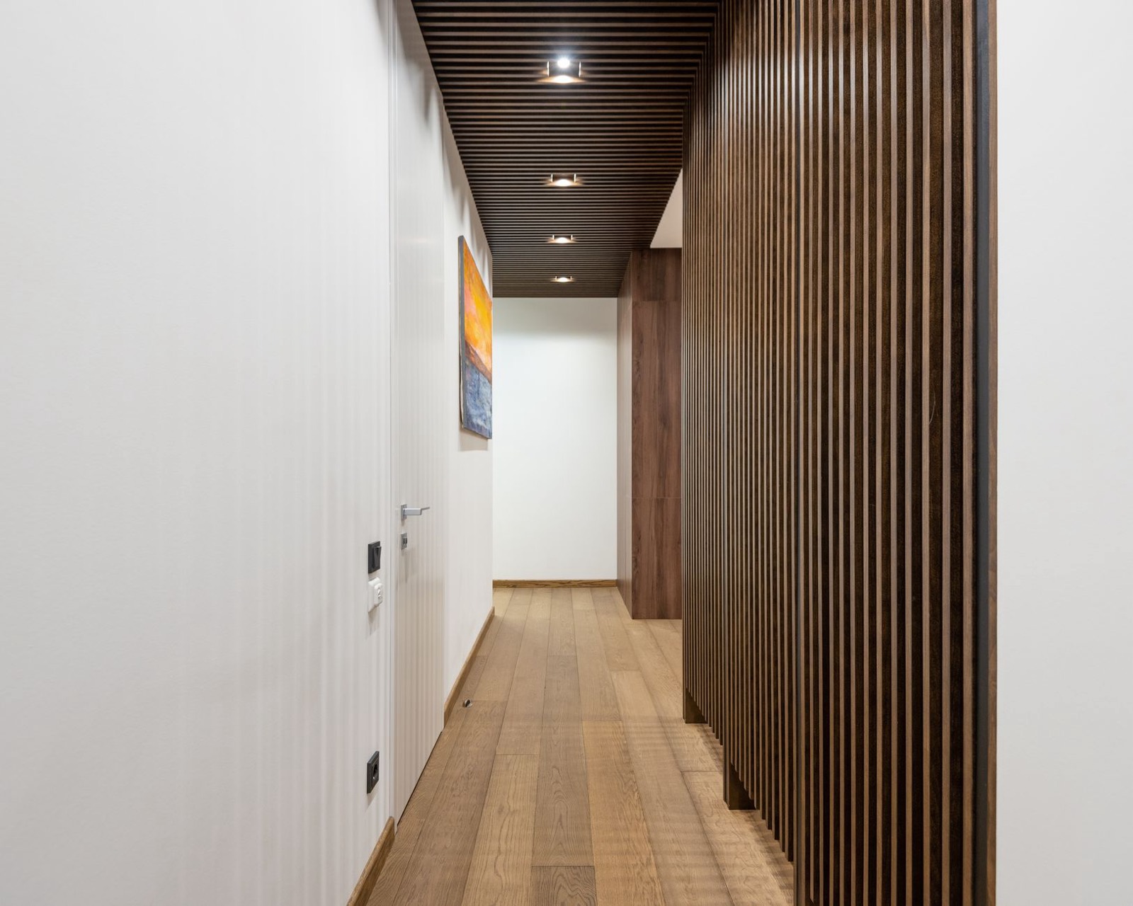 Narrow hallway where a console table must not reduce the clear walking width