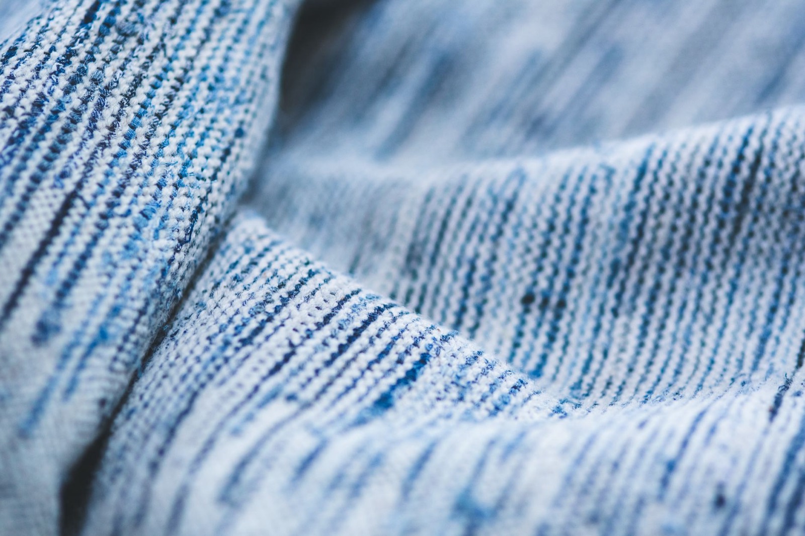 Close-up of woven cotton fabric where fibre and weave determine how sheets feel