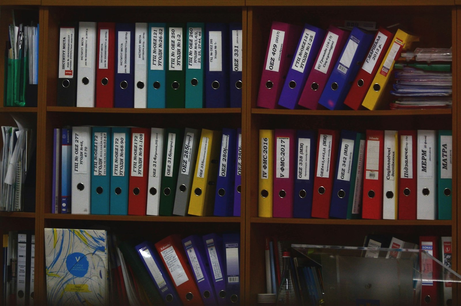 Files and office supplies organised in storage, the main purpose of an office credenza