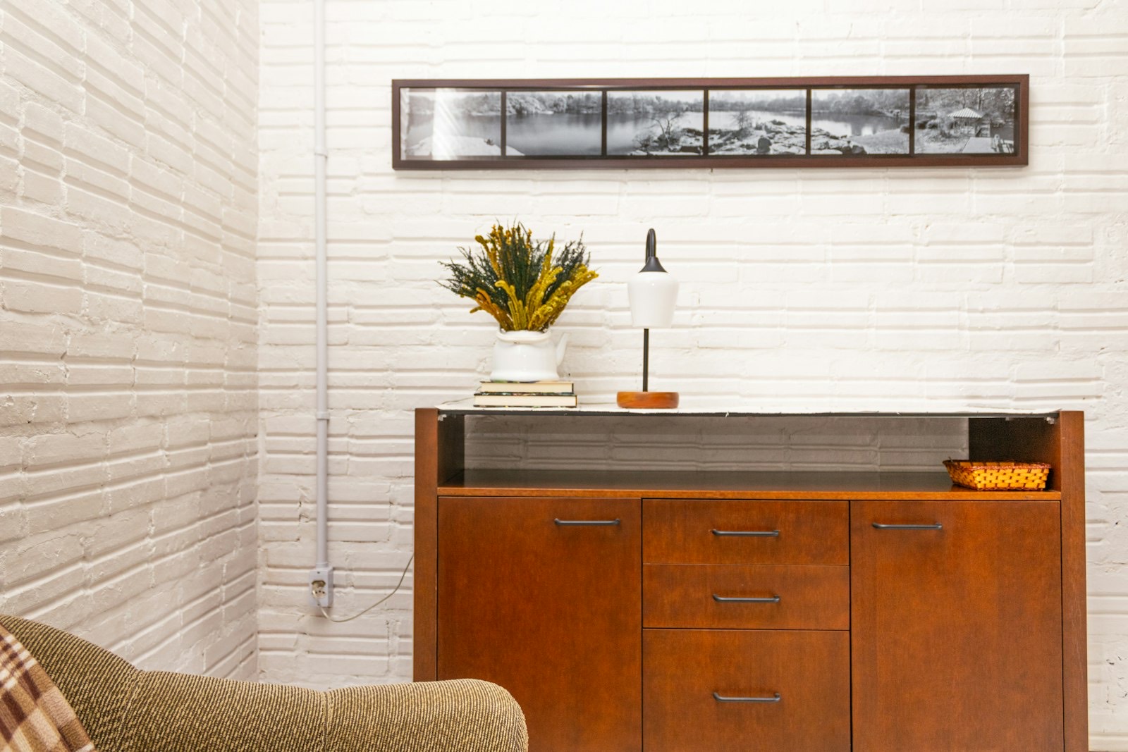 Long low sideboard cabinet showing the shallow depth that distinguishes a credenza from a desk