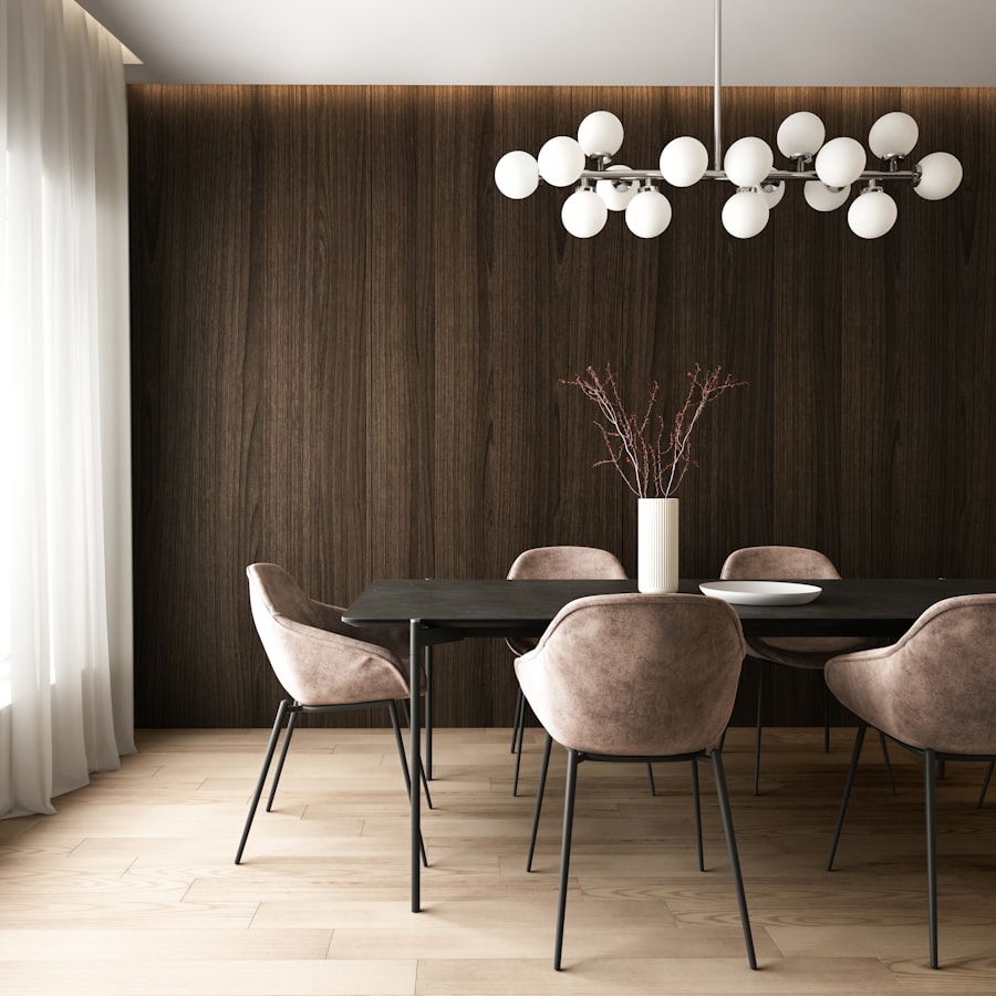 Dark wood accent wall dining room with upholstered chairs