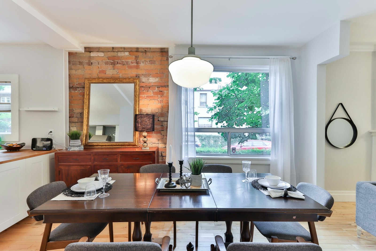 Dining table and chairs set in a dining room, sized to the space around it