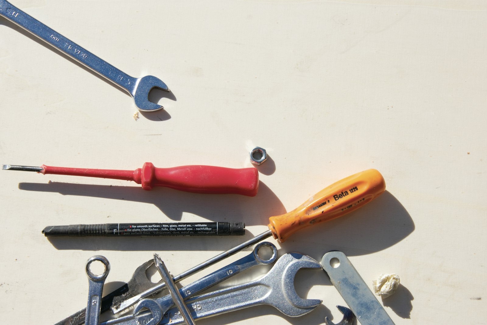 Tools and fixings from disassembled furniture, kept together for reassembly