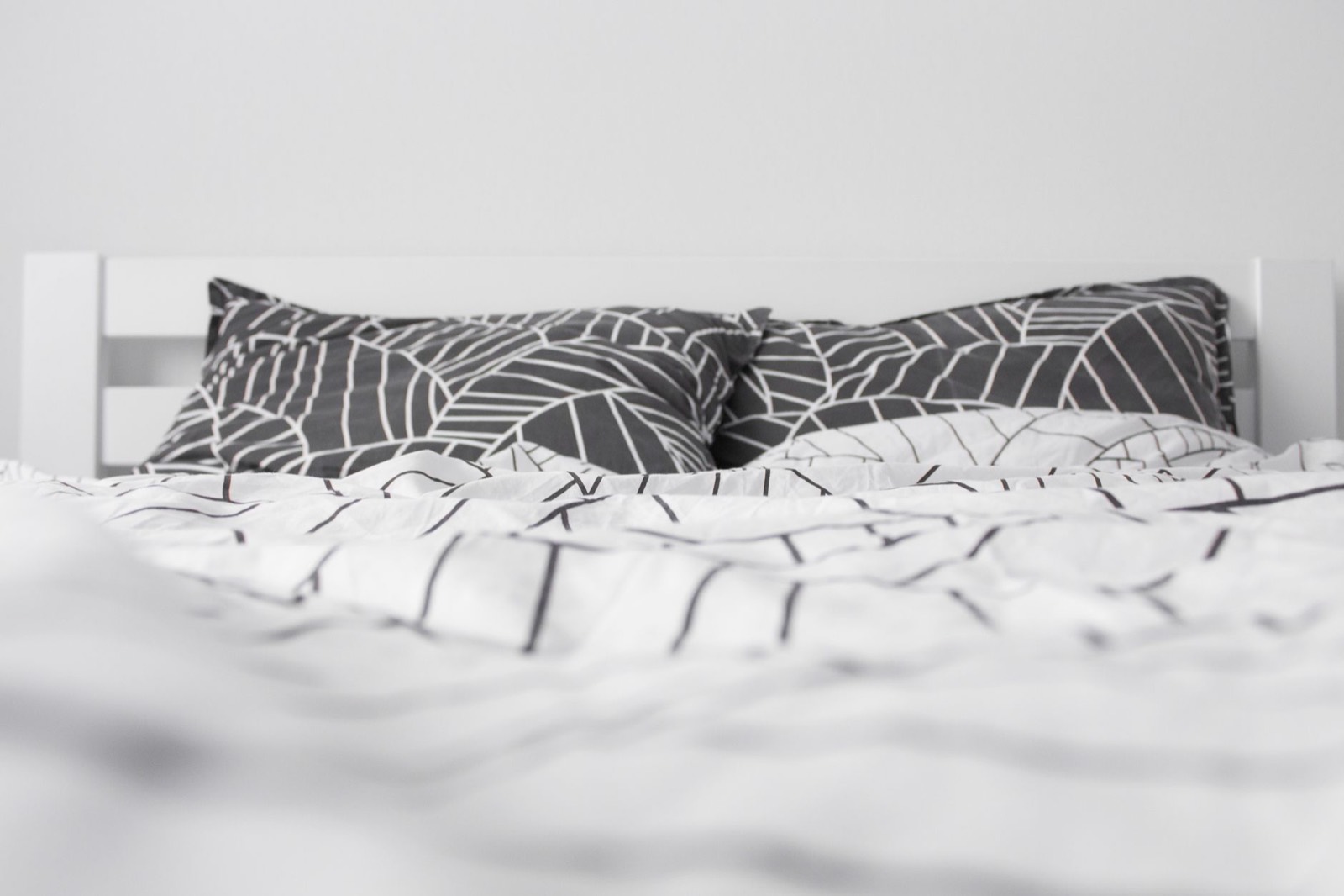 Layered duvet and cover on a bed, the top layer that goes over the sheets