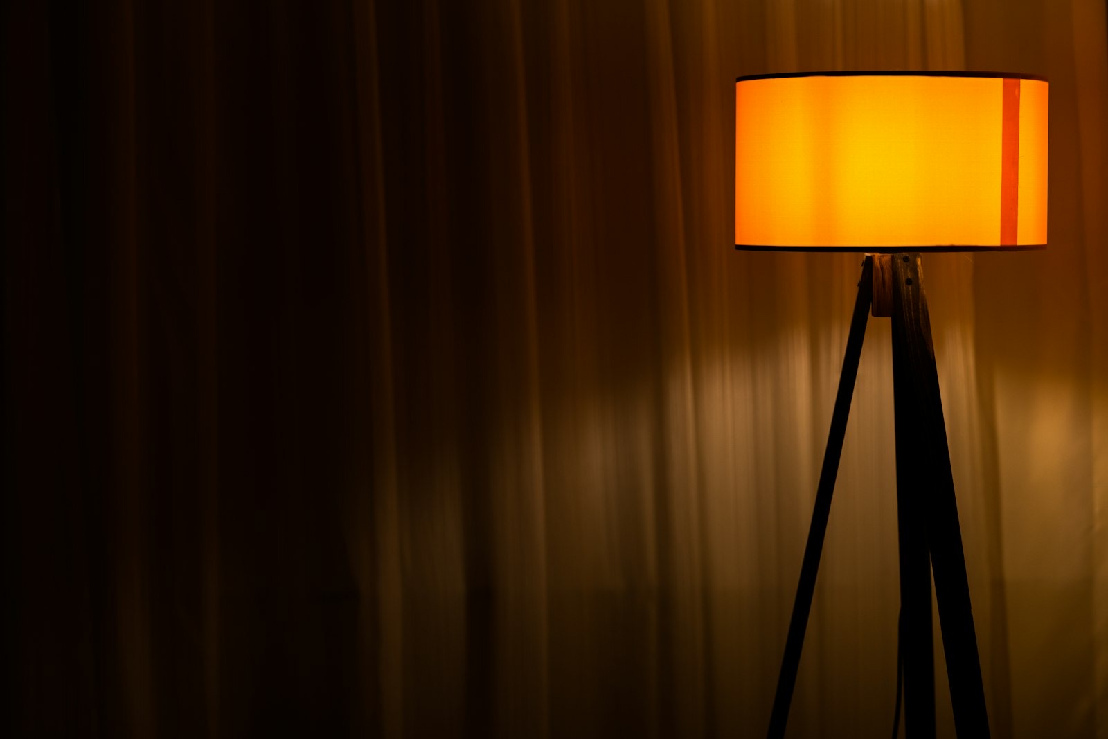 End table beside a sofa arm with a lamp, matched to the arm height