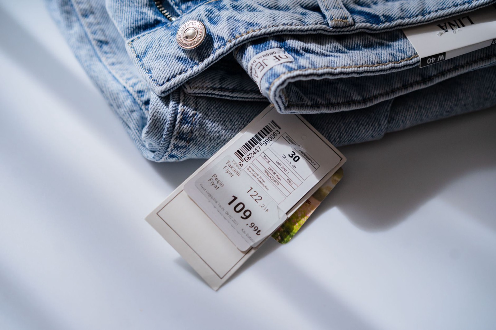 Price label on a showroom piece, where floor models carry year-round discounts