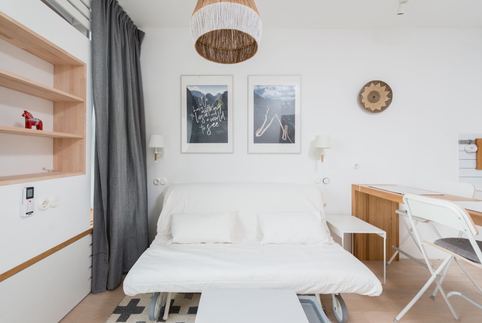 Futon in its upright seating position, where the same cushion serves as both seat and mattress