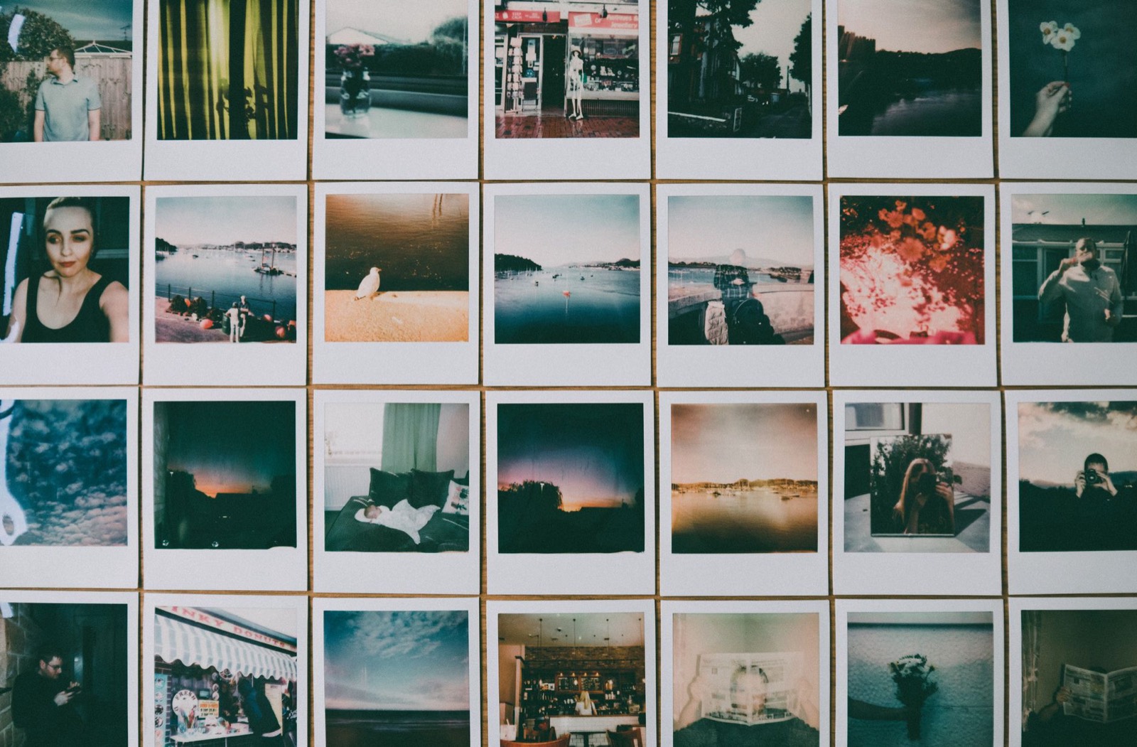 Framed prints in an even grid with consistent spacing between frames