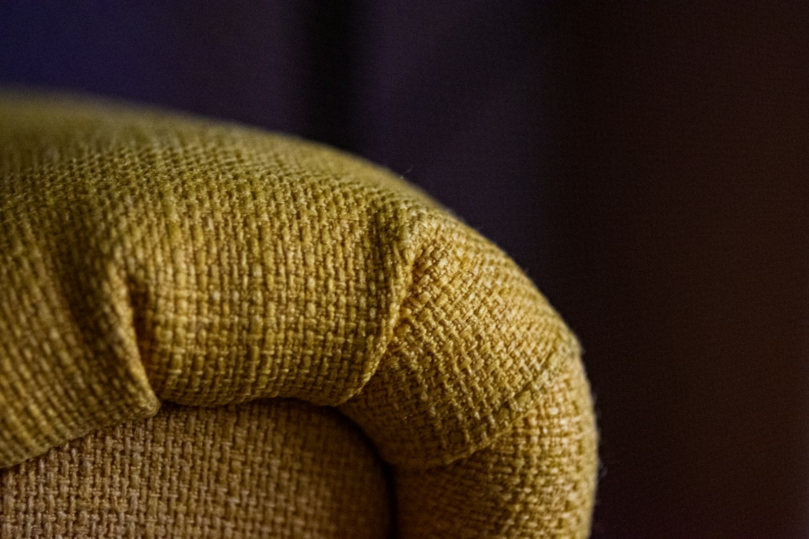 Upholstery fabric detail on a nursery chair, where washable covers matter most