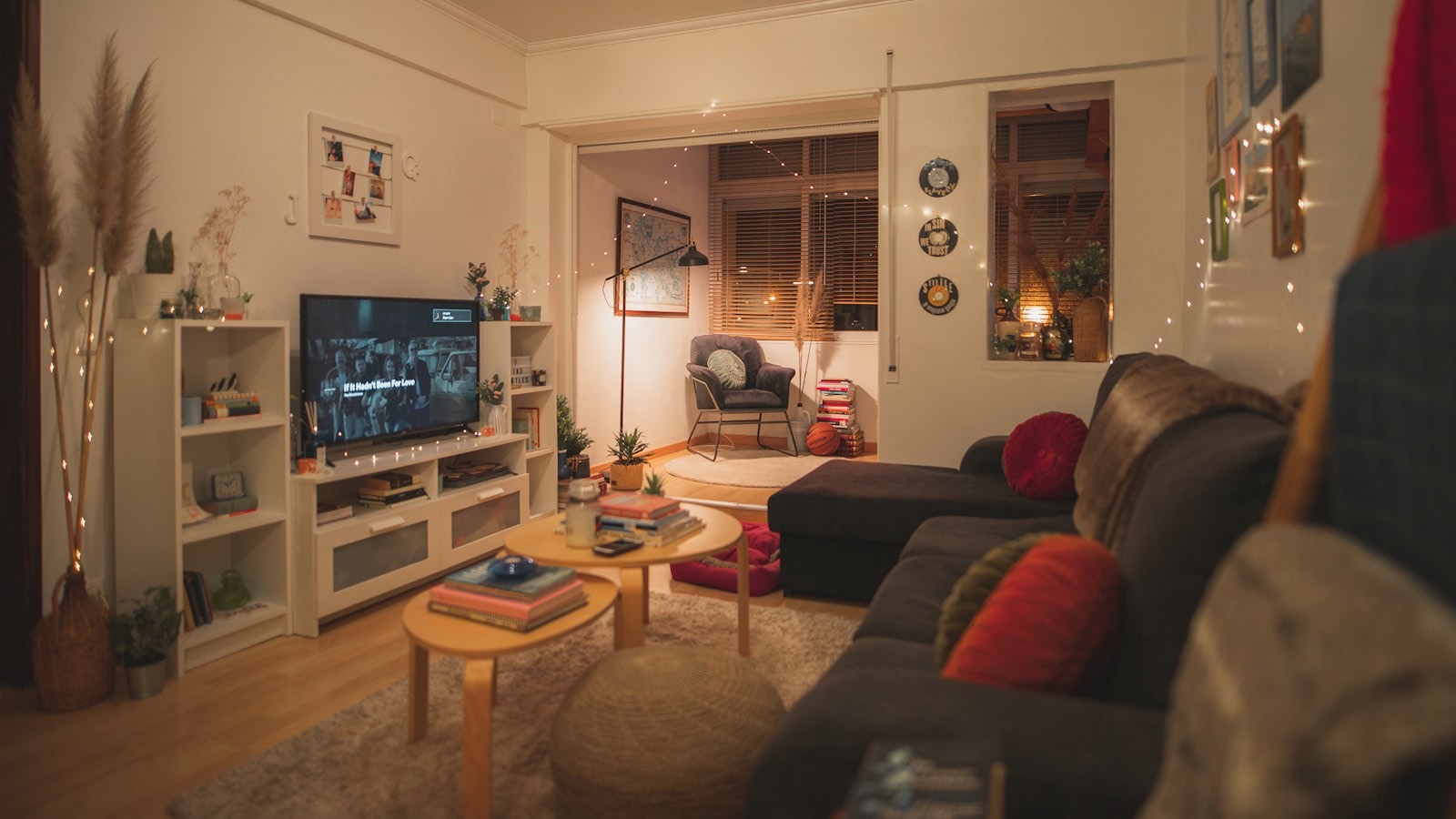 Living room lit by several warm light sources rather than a single ceiling fixture