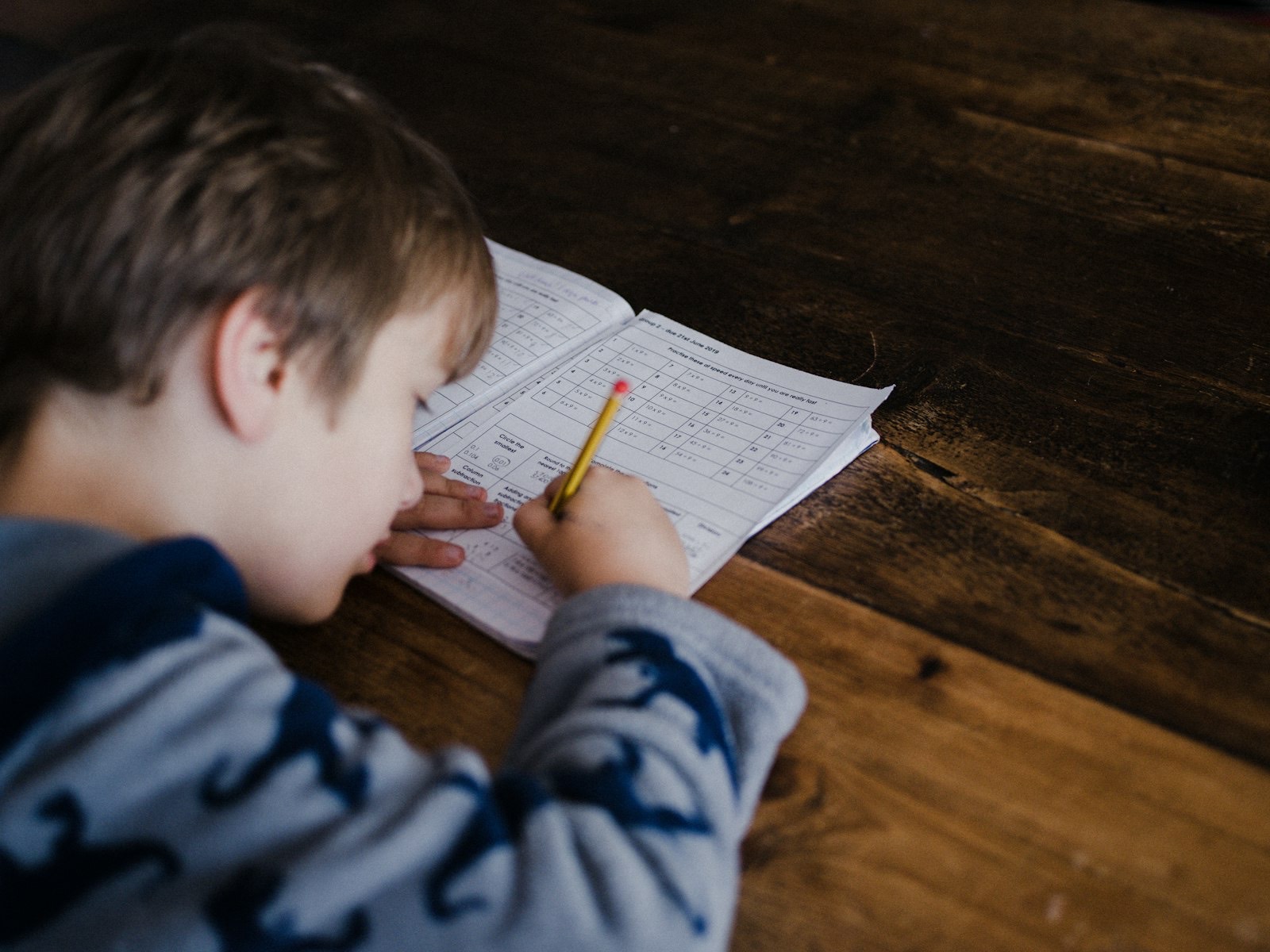 Child working at a desk at the correct height for their size