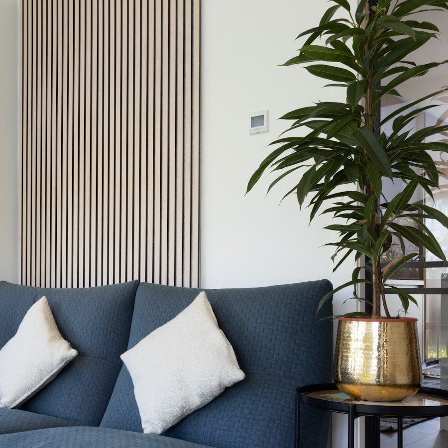 Navy blue sofa with white throw pillows