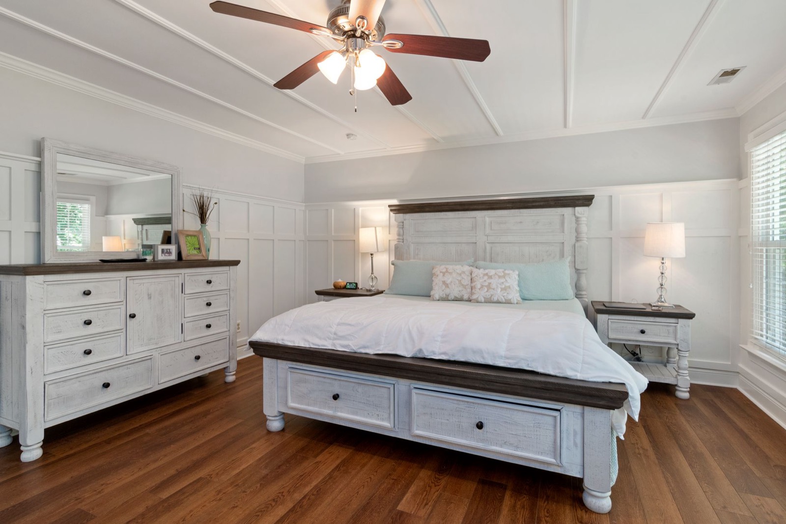 Coordinated bedroom furniture where the bed and dresser share a finish