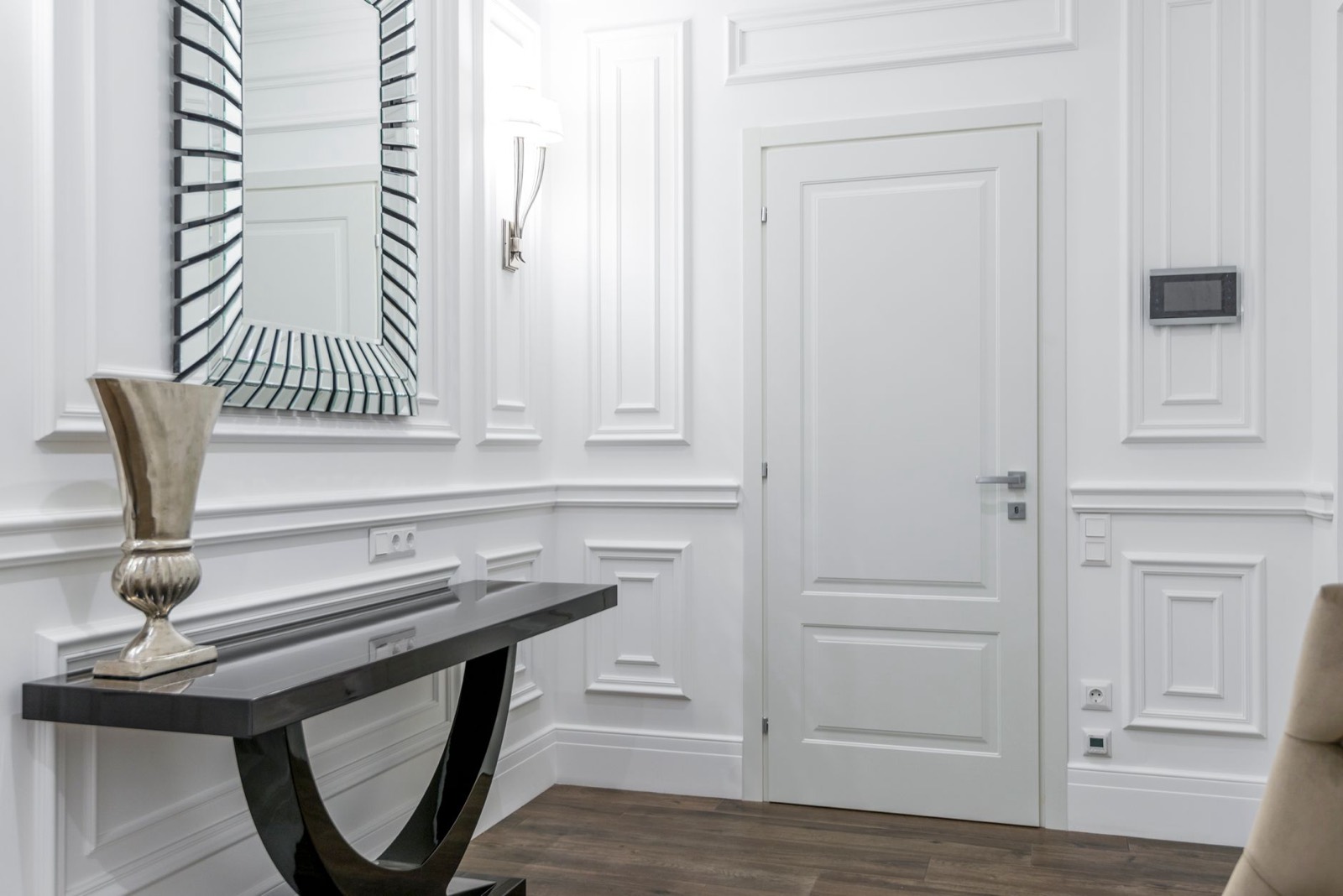 Mirror hung above a console table, the most reliable entryway pairing