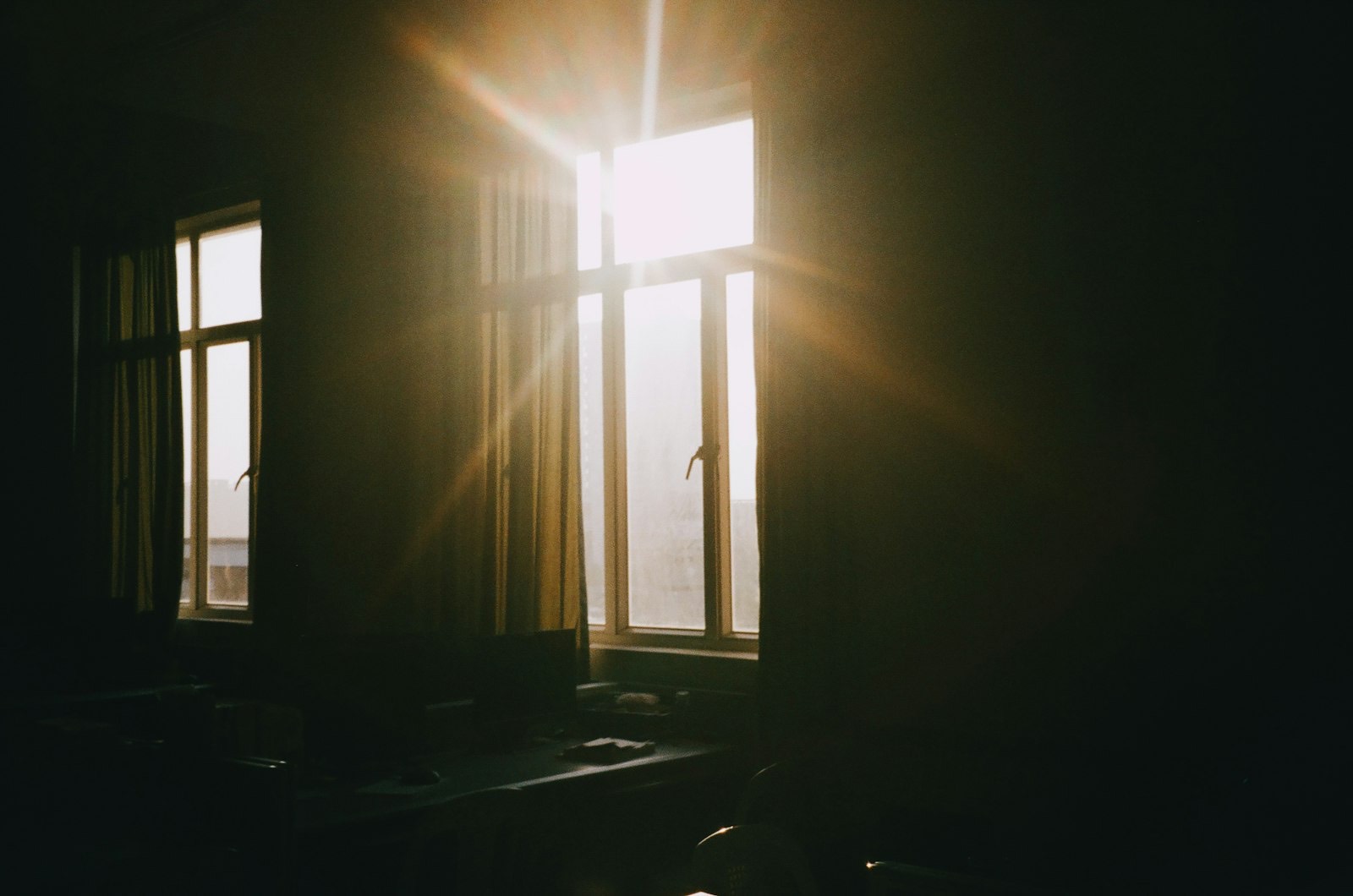 Mirror positioned opposite a window, bouncing daylight further into the room