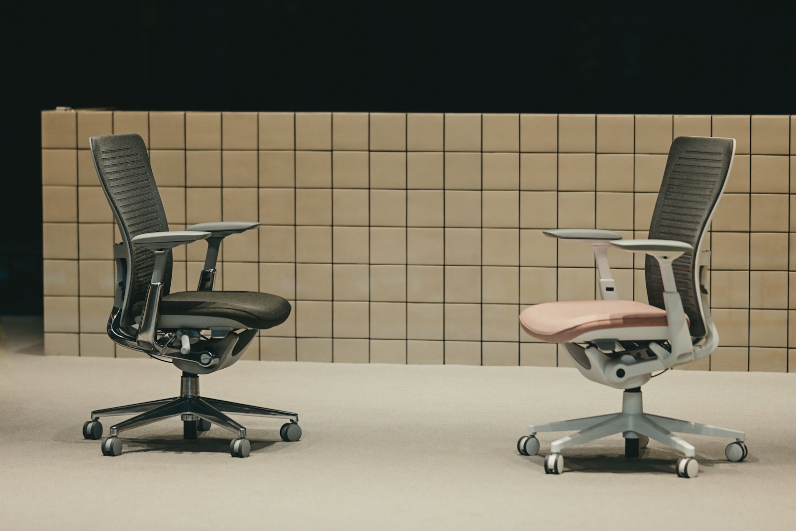 Office chairs displayed in a showroom where adjustments can be tested while seated