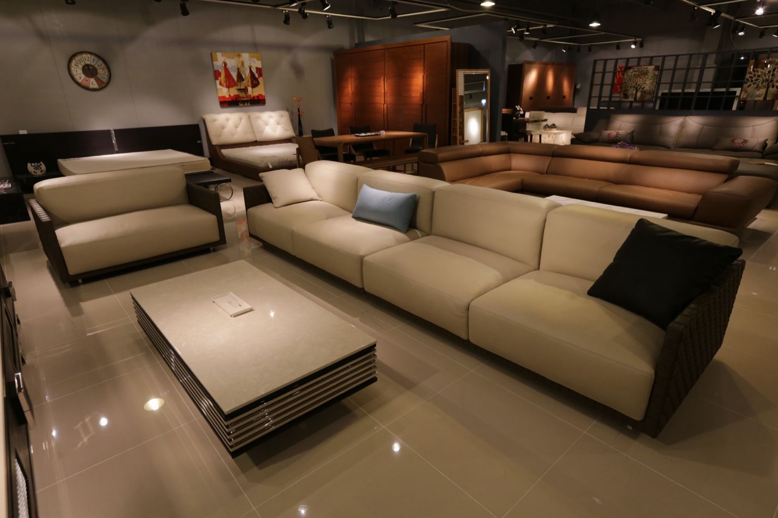 Ottomans and benches displayed in a showroom where heights can be compared