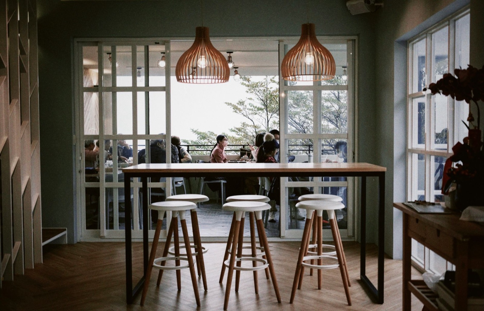 Low pendant lighting hung over a table rather than lighting the whole room