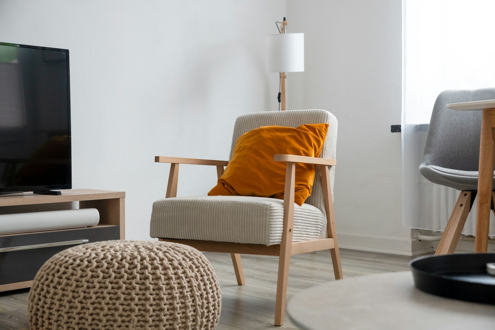 Upholstered recliner armchair positioned in a living room