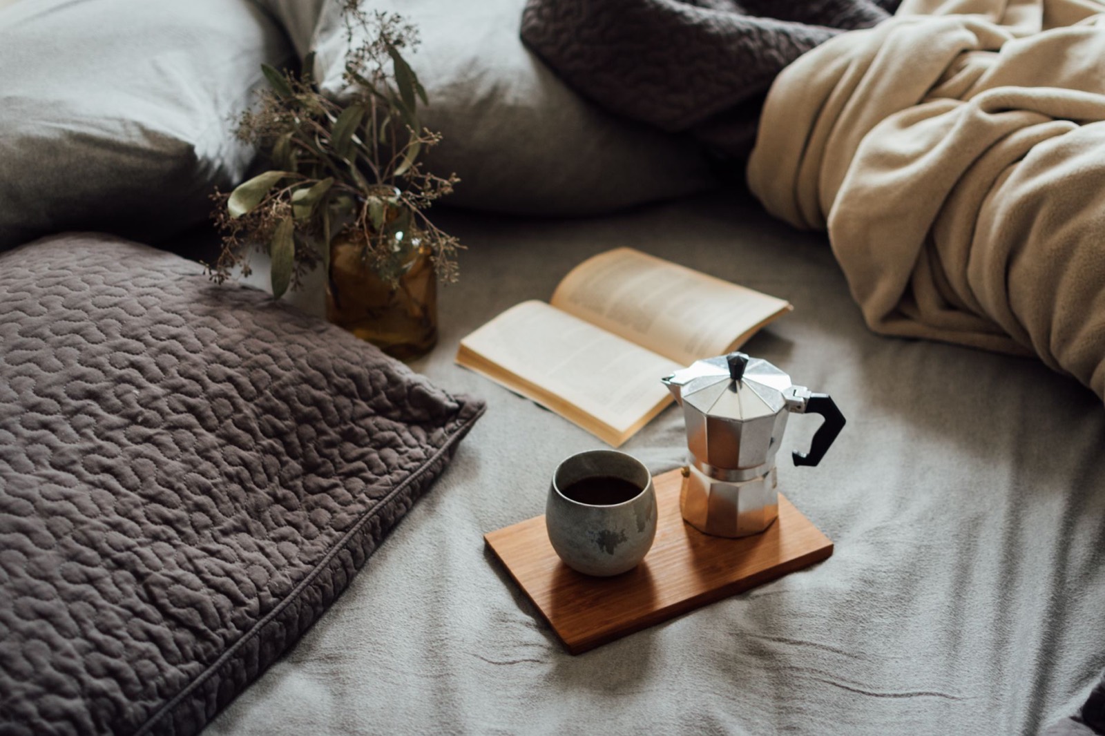 Heavier winter bedding layers on a bed for cooler months