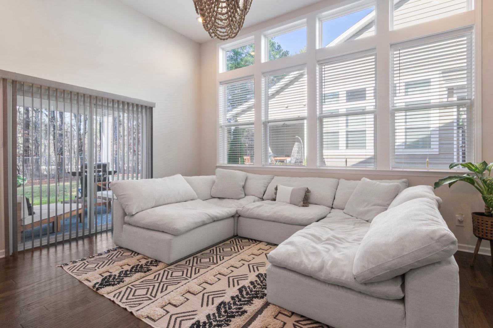 L-shaped sectional sofa positioned in the corner of a living room