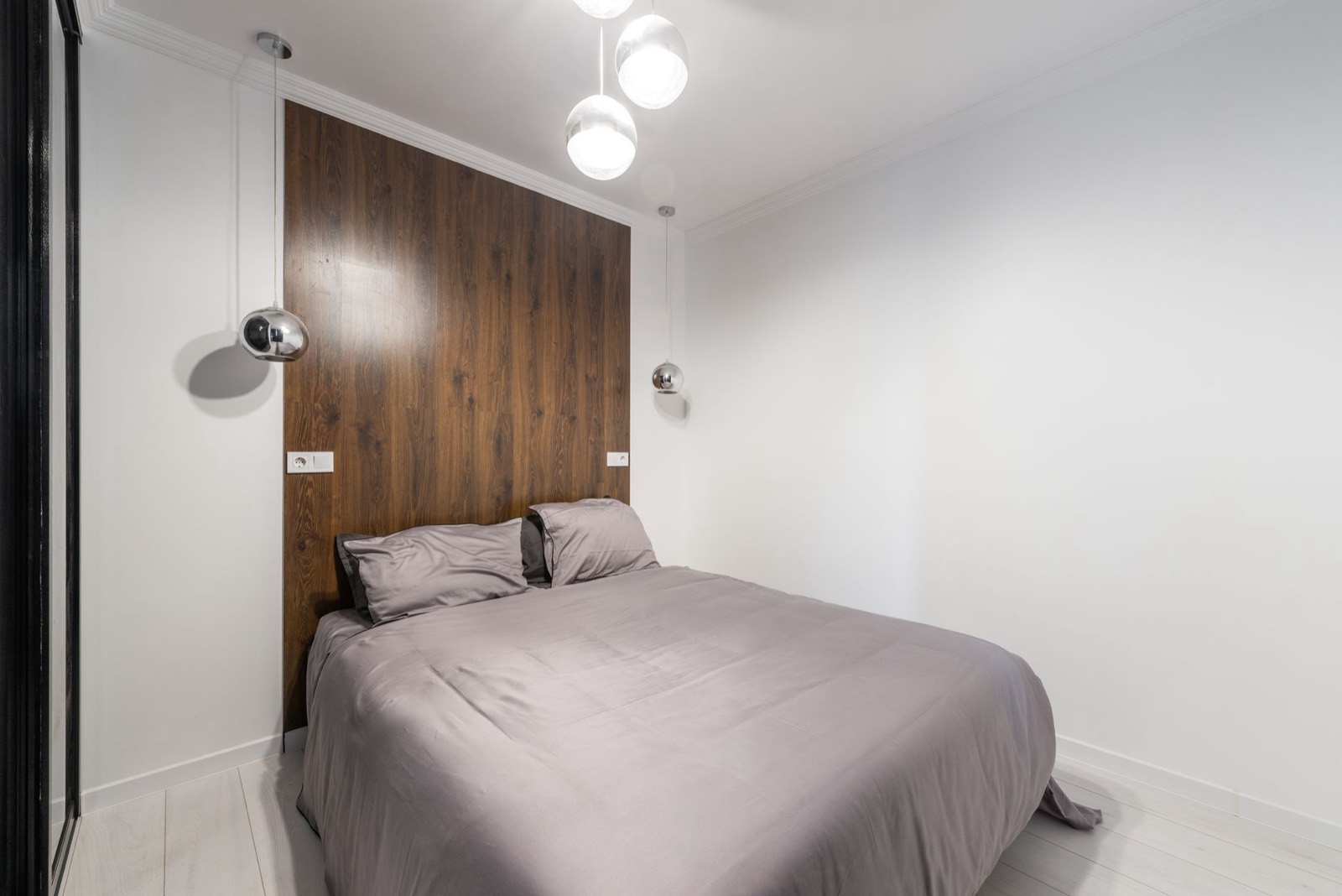 Small spare room laid out with the bed against a wall and one nightstand