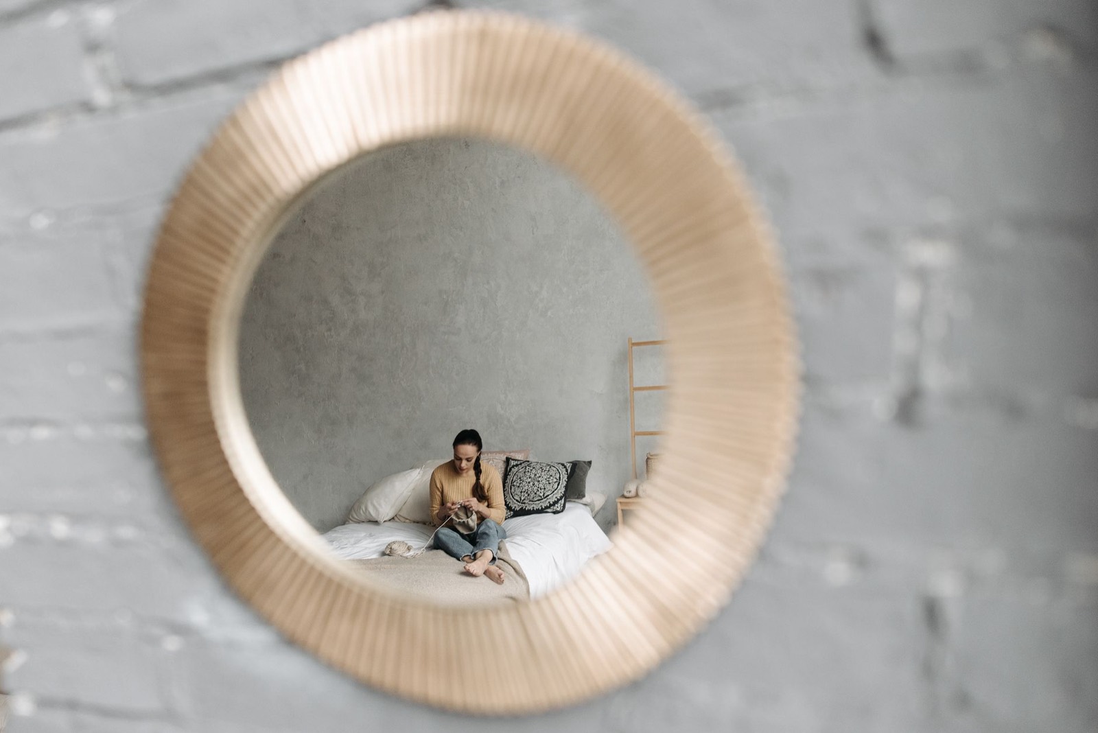 Separate wall-mounted mirror above a table, an alternative to a fixed vanity mirror