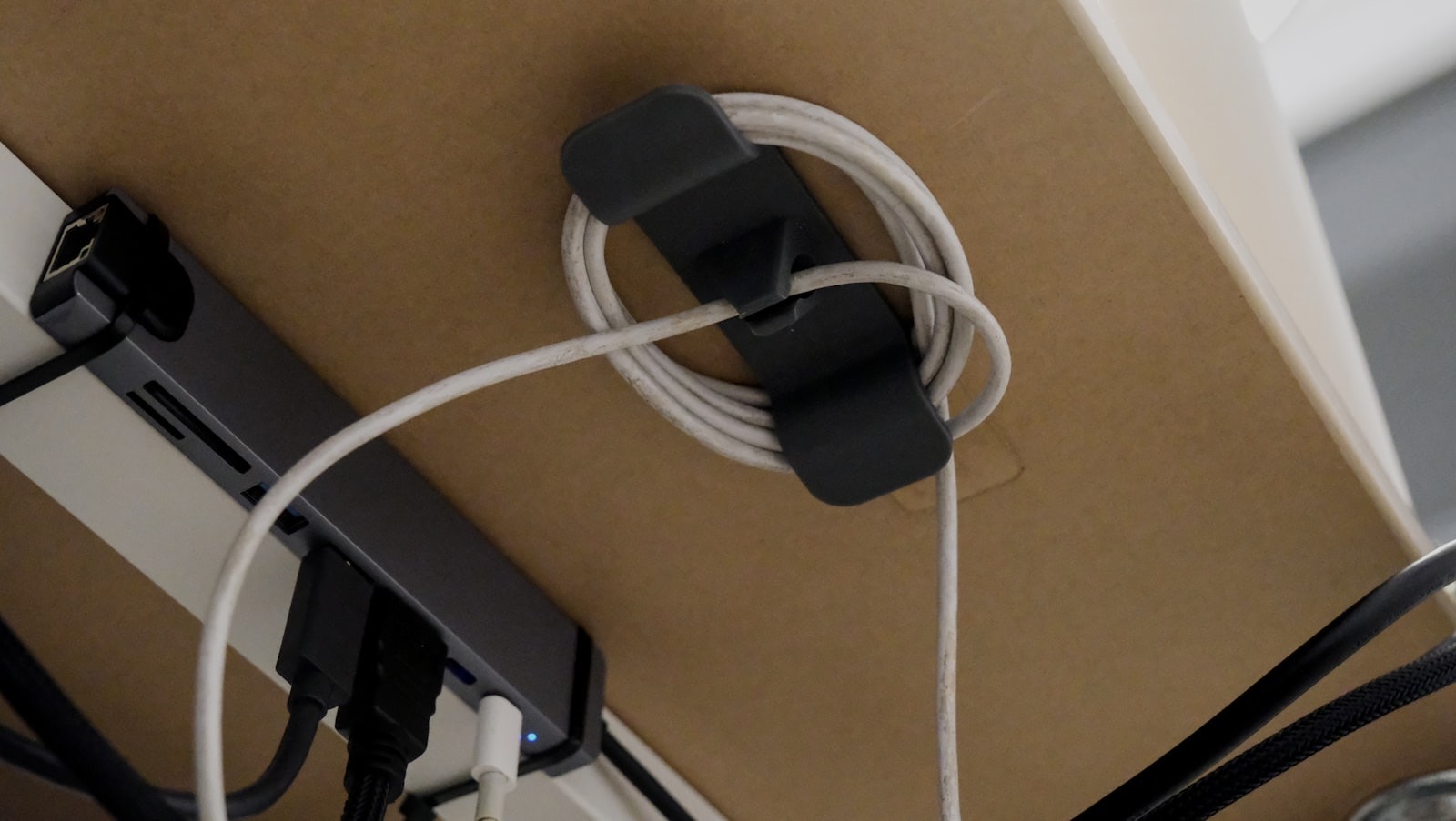Cables behind a media unit, showing why cable access and ventilation matter