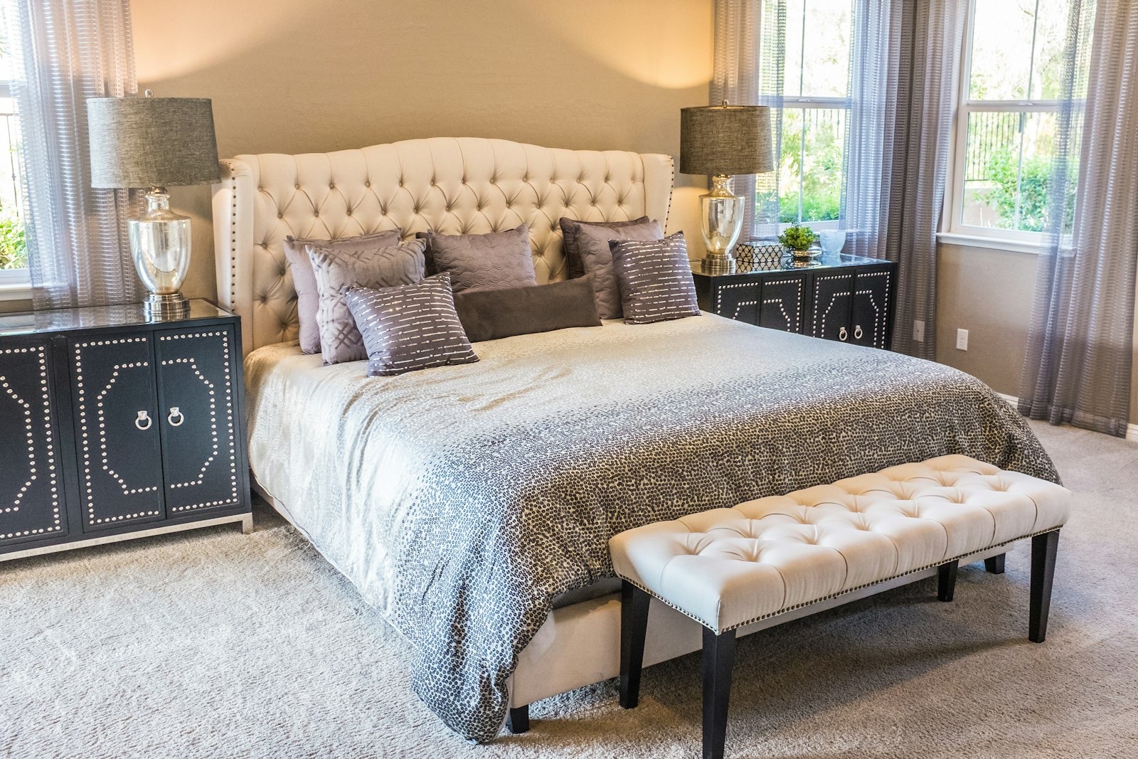 Matching nightstands either side of a bed creating a symmetrical bedroom layout