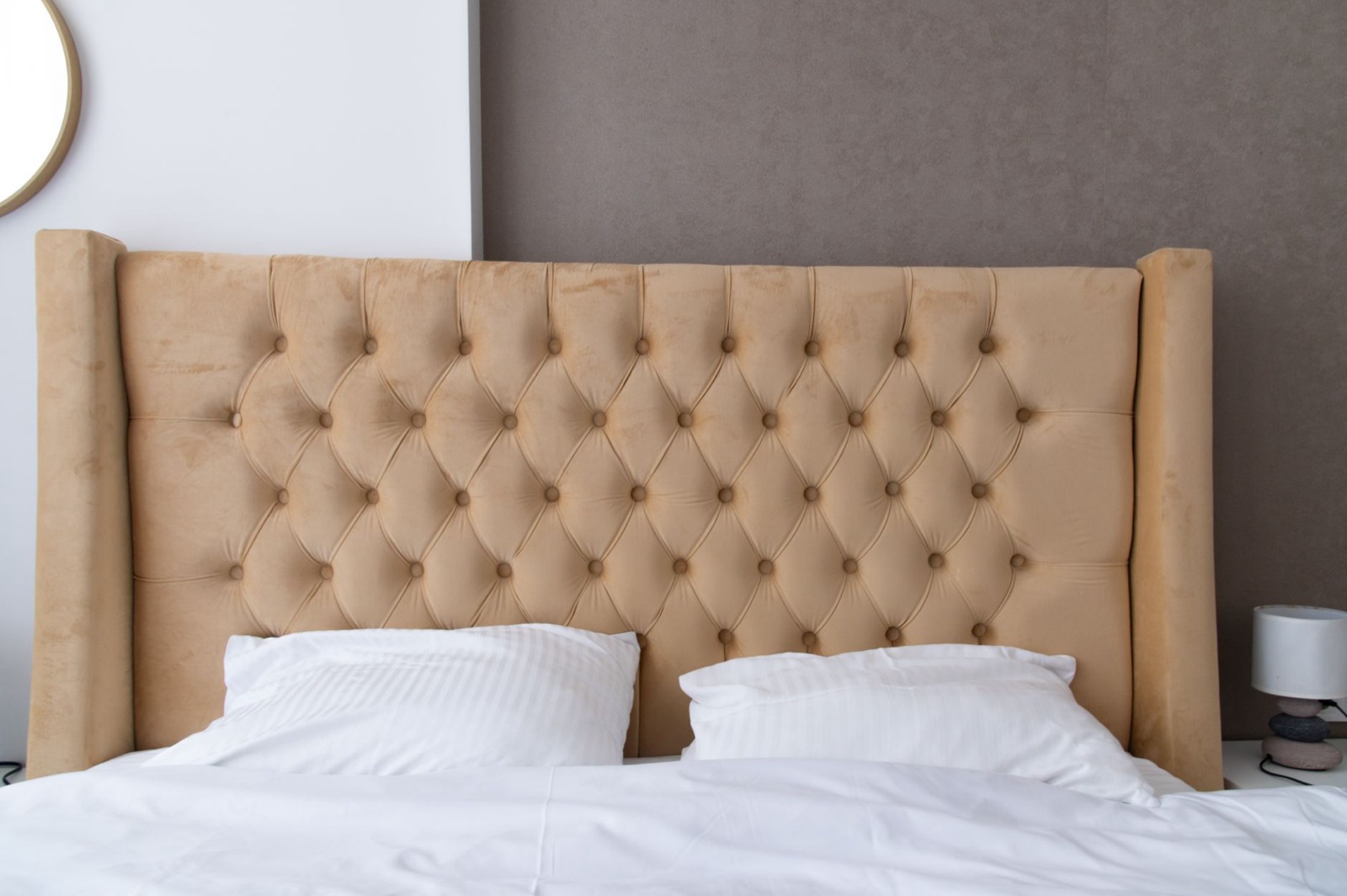 Padded upholstered headboard that is comfortable to sit against in bed