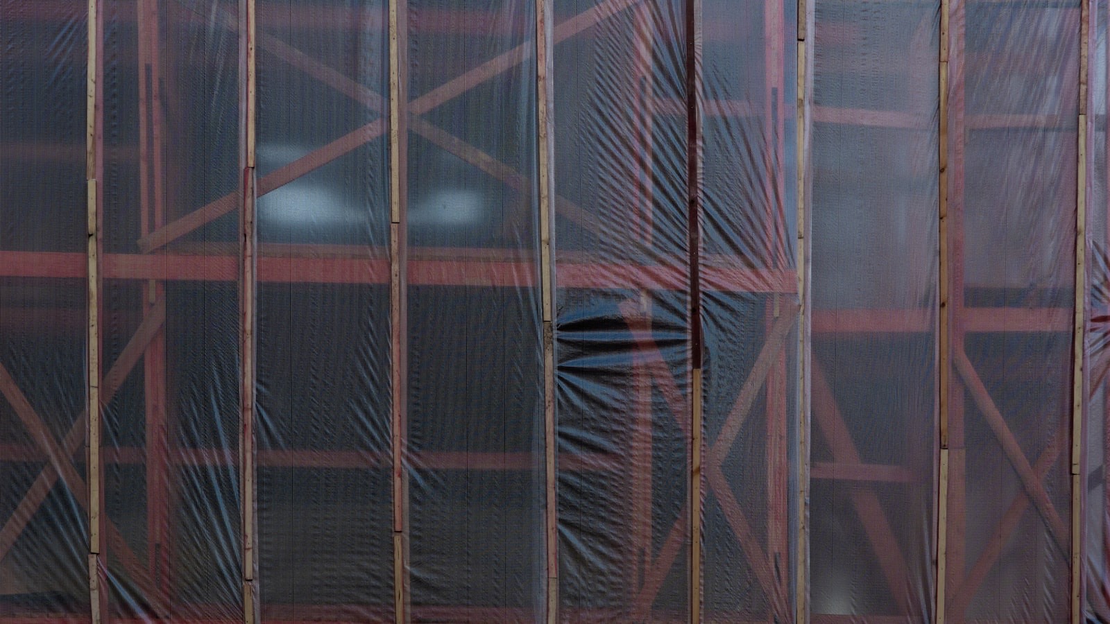 Furniture protected with moving blankets before any plastic wrap is applied